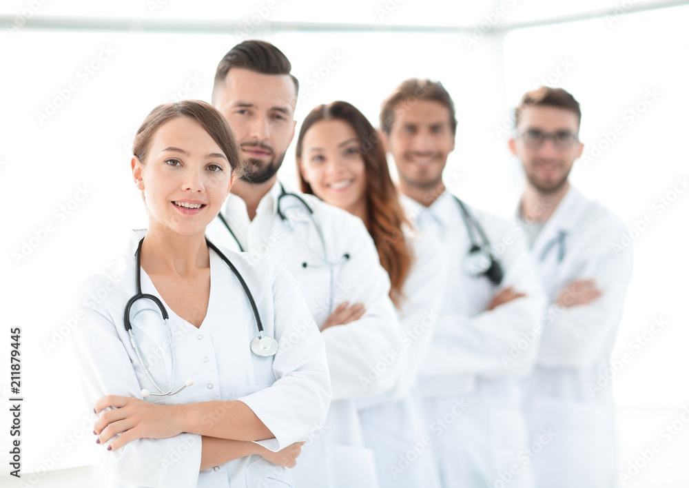woman-pediatrician on the background of colleagues woman-pediatrician on the background of colleagues