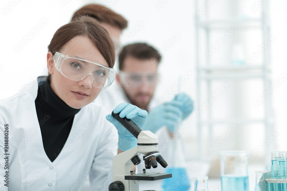 female scientist in a laboratory. female scientist in a laboratory.