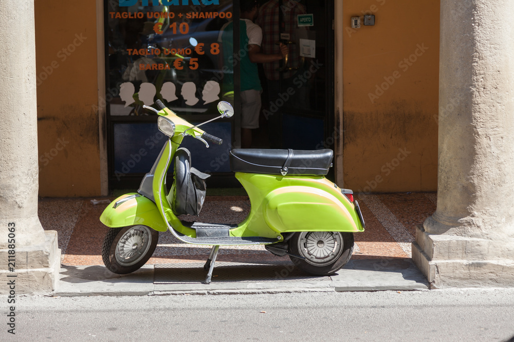 Bologna ITALY July 2018 - vespa special - old italian vintage scooter in front a hair style shop - italian style