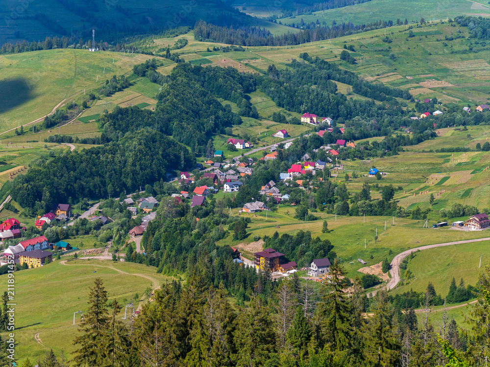 Small villages with lovely beautiful houses among green trees and vast mountains