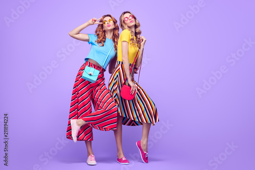 Two Girls Blowing lips Having Fun. Summer Outfit