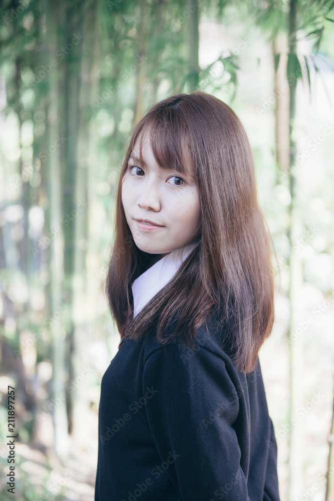 Portrait of asian japanese school girl costume looking at park outdoor film vintage style Portrait of asian japanese school girl costume looking at park outdoor film vintage style