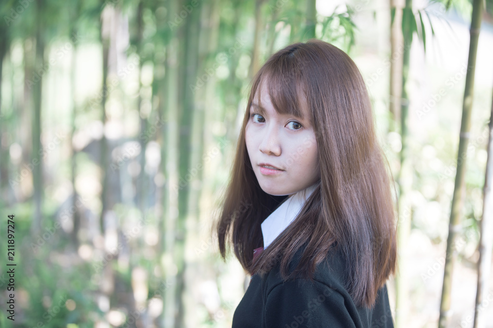 Portrait of asian japanese school girl costume looking at park outdoor film vintage style Portrait of asian japanese school girl costume looking at park outdoor film vintage style