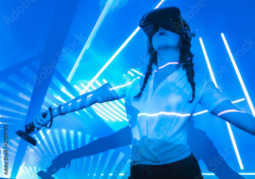 Cheerful woman having VR experience photo