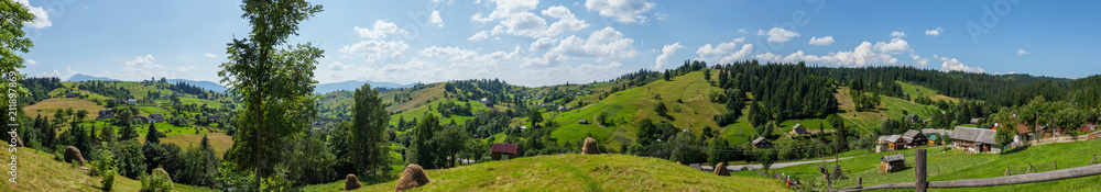 a magnificent landscape of a small village located in a mountainous area