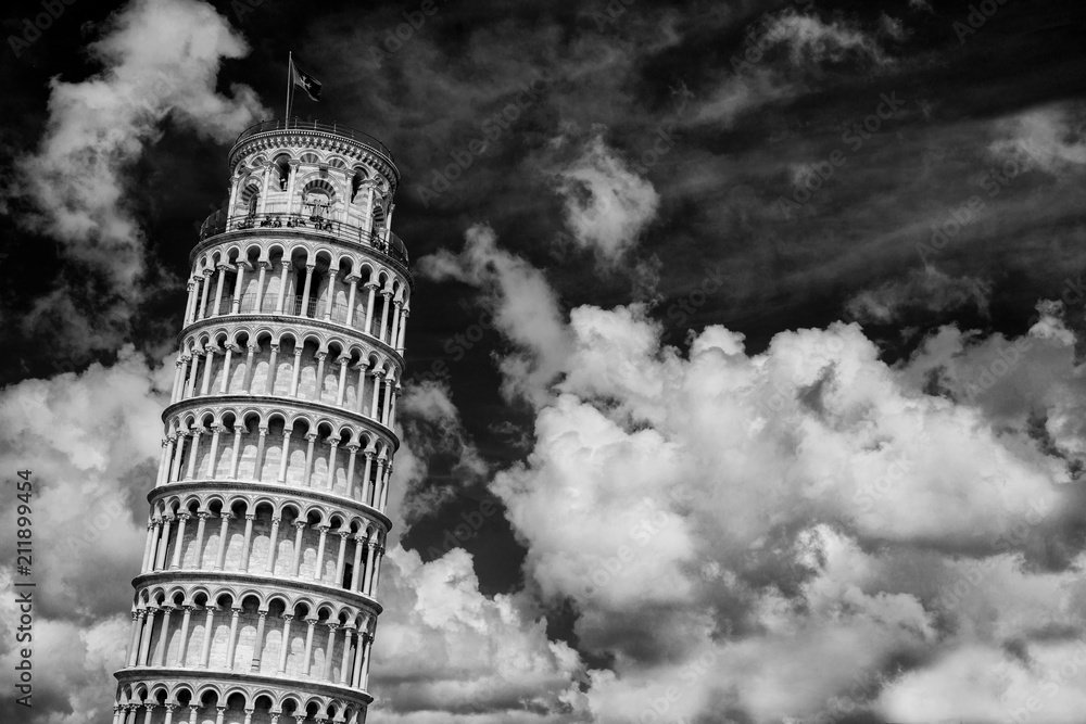 The famous Leaning Tower of Pisa among beautiful clouds (Black and White)