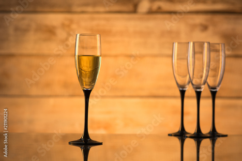 Glasses with champagne and empty glasses