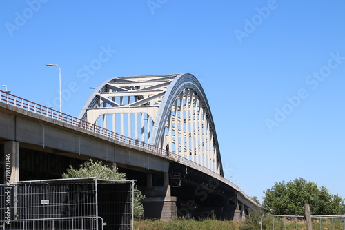 Old steel suspsension bridge over the river Lek at Vianen for highway A2 in the Netherlands. © André Muller