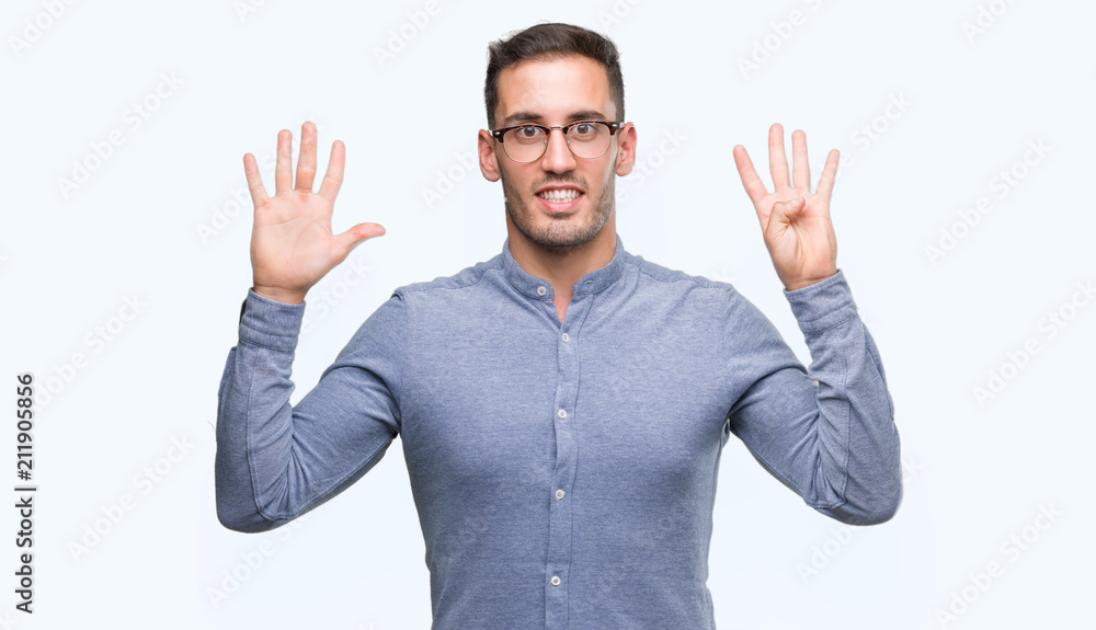 Handsome young elegant man wearing glasses showing and pointing up with fingers number nine while smiling confident and happy.