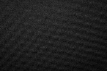 Black fabric texture background. Dark clothing material.