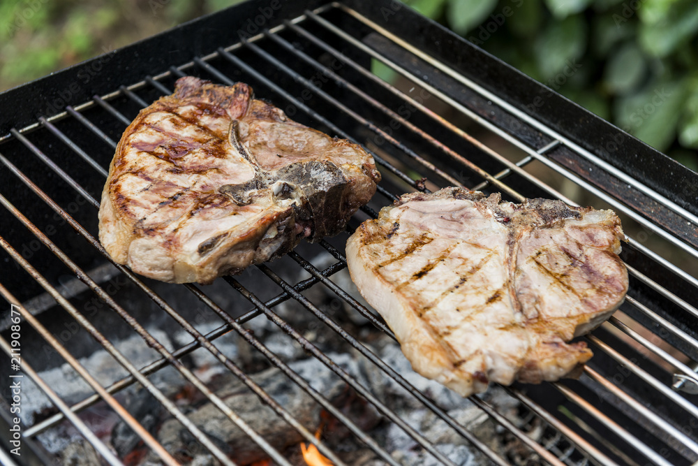 T-bone chop of pork on the grill T-bone chop of pork on the grill