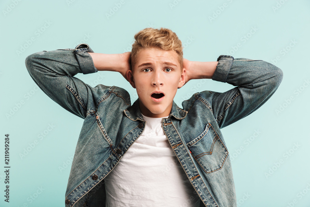 Portrait of a shocked casual teenage boy Portrait of a shocked casual teenage boy