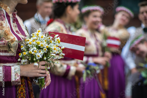 Song and dance festival in Latvia. Procession in Riga. Elements of ornaments and flowers. Latvia 100 years. photo