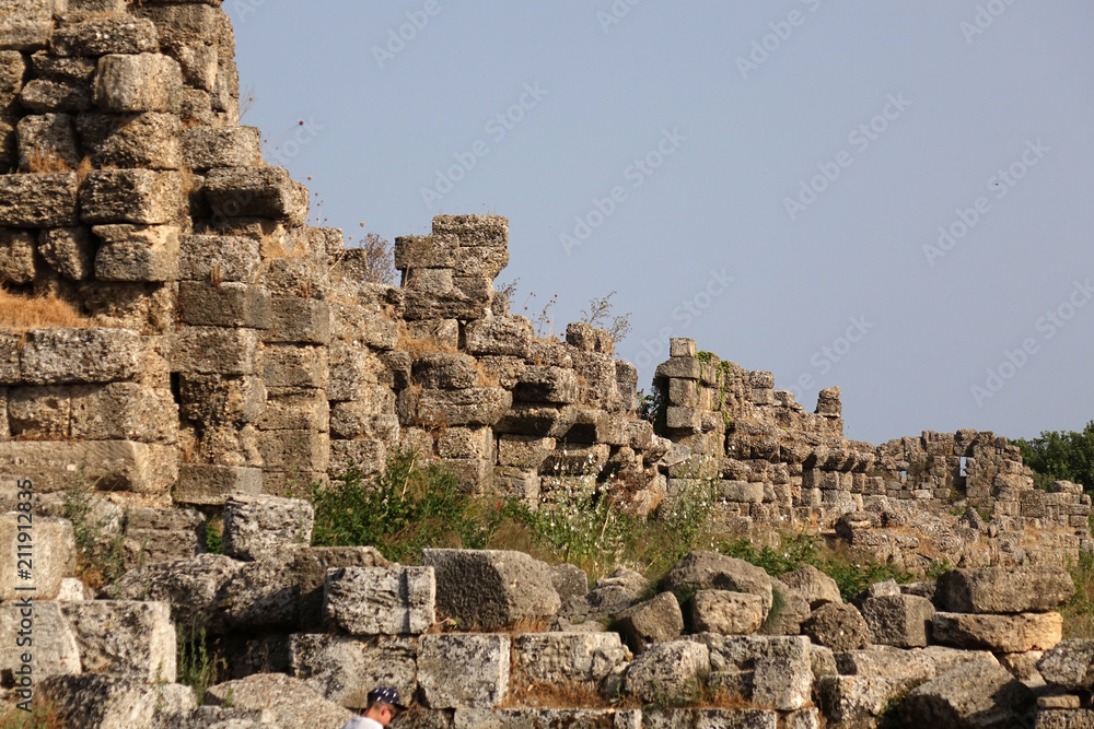 The ruins of the city streets and ancient theater in side.