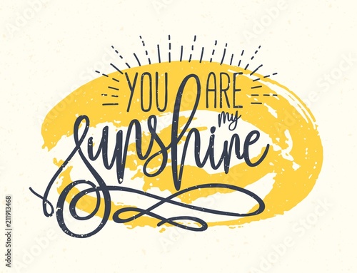 You Are My Sunshine confession or phrase written with beautiful cursive font against yellow round paint stain on background. Artistic vector illustration for St. Valentine's Day greeting card.