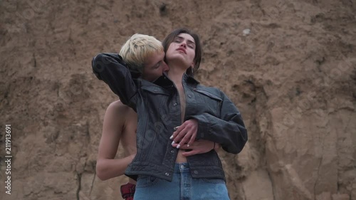 passionate couple in a denim embraces. photo