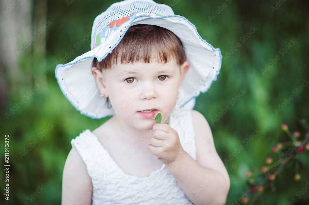 happy little girl playing on nature sitting on tree happy little girl playing on nature sitting on tree