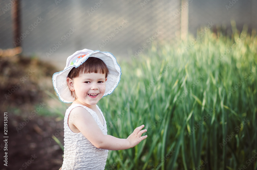 happy little girl playing on nature sitting on tree happy little girl playing on nature sitting on tree