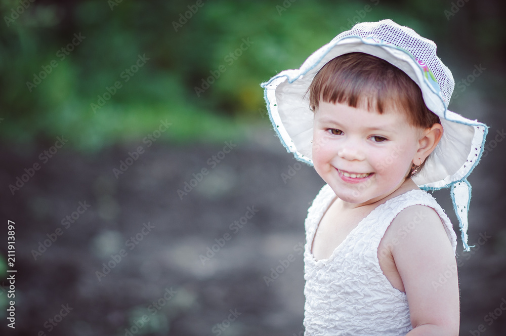 happy little girl playing on nature sitting on tree happy little girl playing on nature sitting on tree