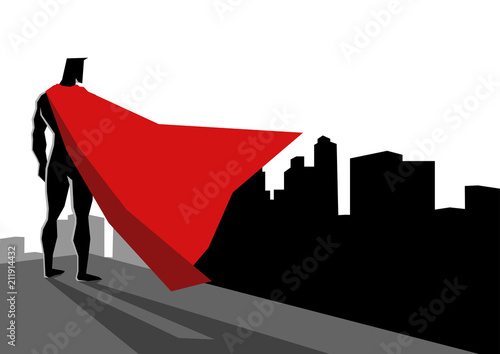 Superhero standing on the edge of high building