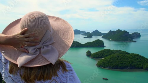 Female Traveler Enjoying View of Tropical Islands at Angthong National Marine Park in Thailand photo