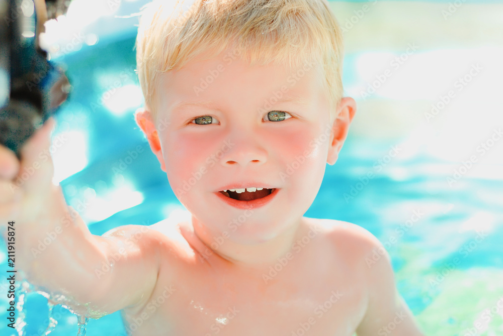 Portrait of baby boy enjoying swimming in inflatable pool Portrait of baby boy enjoying swimming in inflatable pool