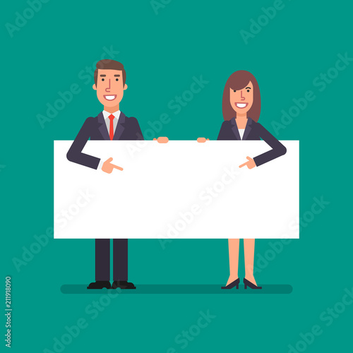 Businessman and business woman holds and points to clean sheet paper
