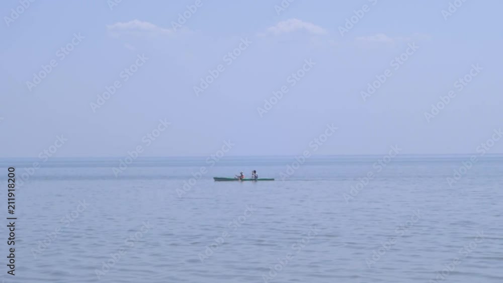 couple swim on canoe, summer sea background