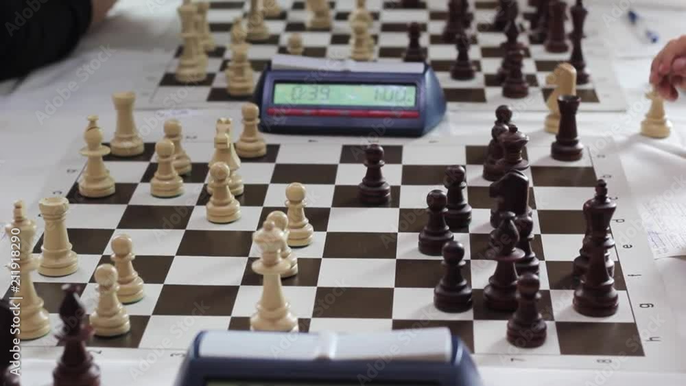 The hand of a man playing chess The hand of a man playing chess