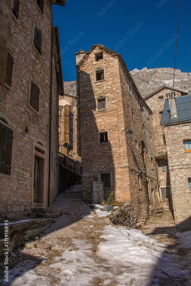 A street in the hill village of Casso in winter Friuli Venezia Giulia, north east Italy. 
