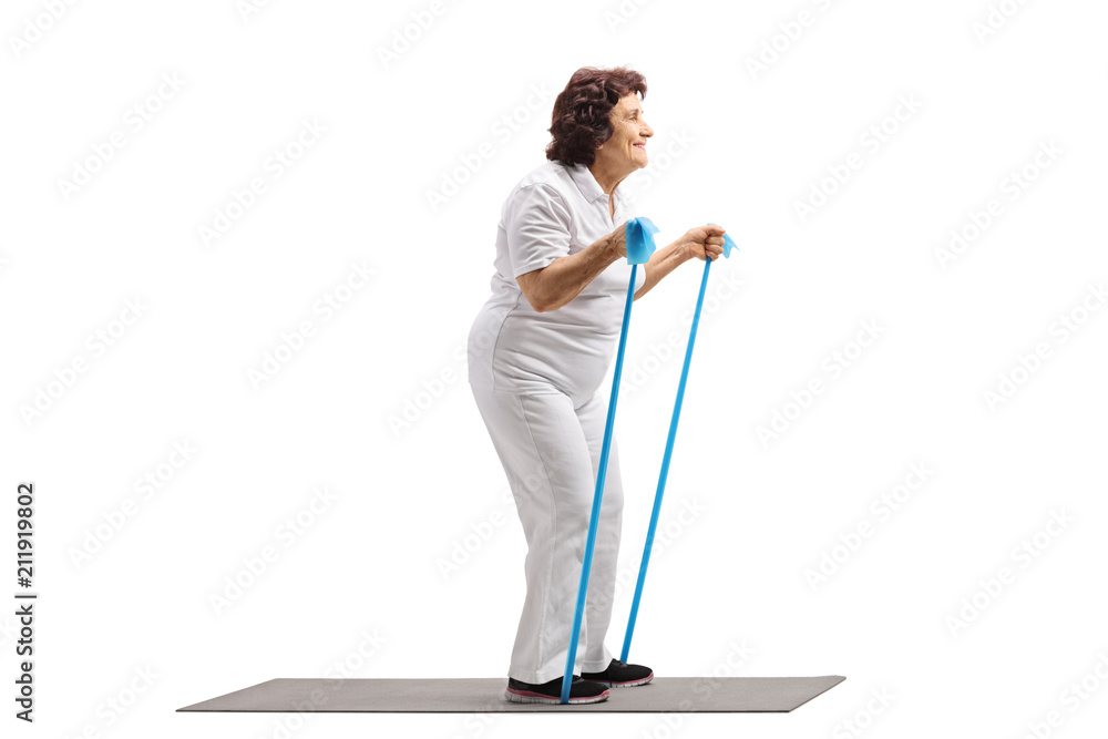 Elderly woman working out with a rubber band Elderly woman working out with a rubber band