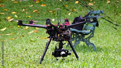 Drone taking off and raising the landing gear. Model DJI S900 with zenmuse and Black Magic Pocket photo