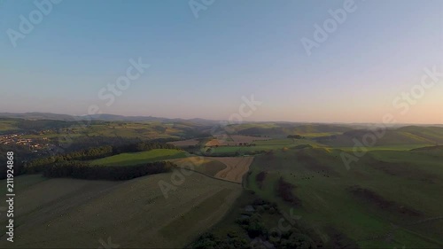 Aerial reveal of a Scottish town at sunset or sunrise photo