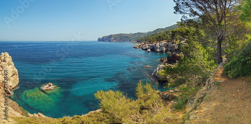 Fototapeta Naklejka Na Ścianę i Meble -  Beautiful landscape coastal promenade path between Deia and Soller villages in Majorca. Panoramic seascape scenery.