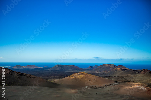 If it wasn't the Ocean, this would look like Moon scape. The vast emptiness and loneliness of the Lanzarote black frozen lava volcanic desert with few sleeping volcanoes and almost clear blue sky