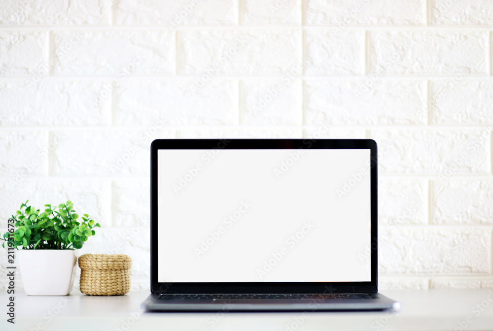 Open the laptop on office desk.front view with copy space. Open the laptop on office desk.front view with copy space.