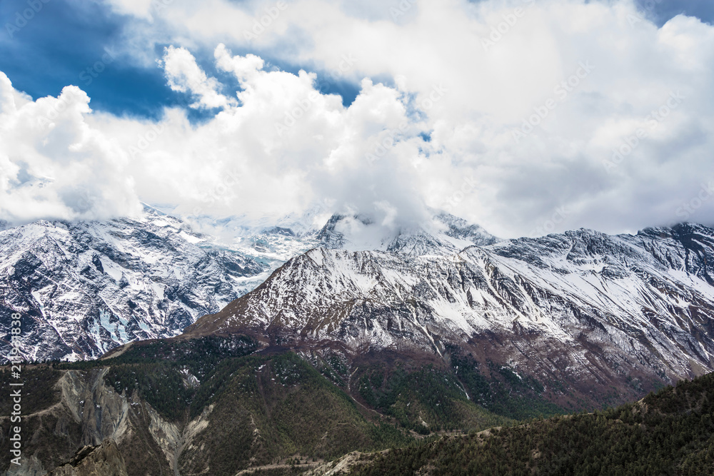 Mountain peaks in snow and clouds, Nepal.