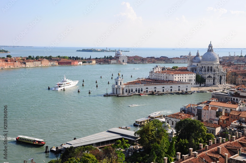 Cityscape with sea and ships in Venice, Italy