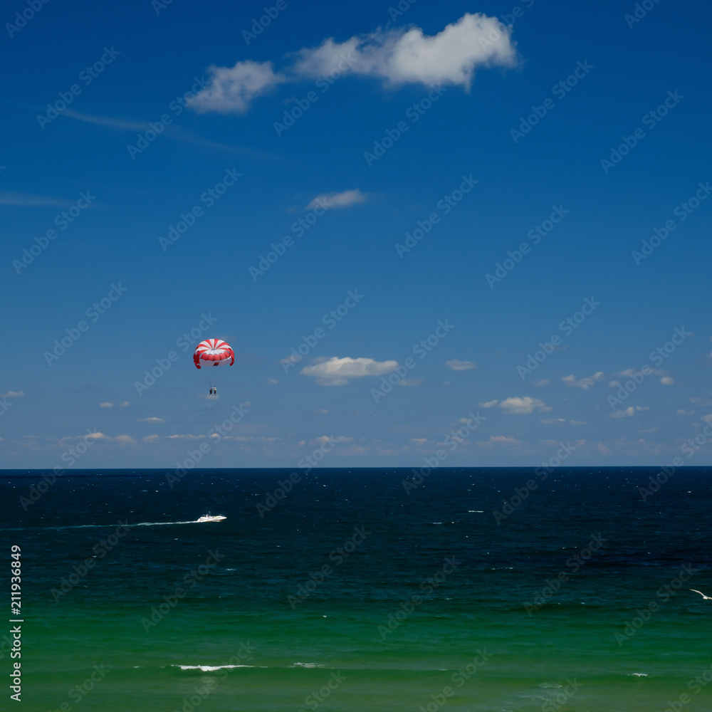 Nessebar beach Bulgaria 25.06.2018 Active recreation - motor boat tows a special parachute. A popular sea attraction parasailing Nessebar beach Bulgaria 25.06.2018 Active recreation - motor boat tows a special parachute. A popular sea attraction parasailing