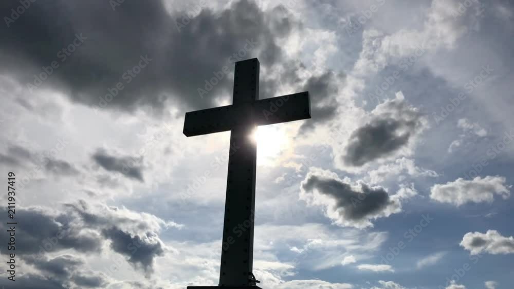 Cross in clouds with rolling clouds time lapse Cross in clouds with rolling clouds time lapse