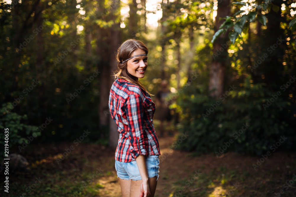 Pretty woman hiking in forest Pretty woman hiking in forest