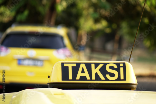 Taxi in Turkey. Taxi car roof sign on bokeh background in Istanbul .