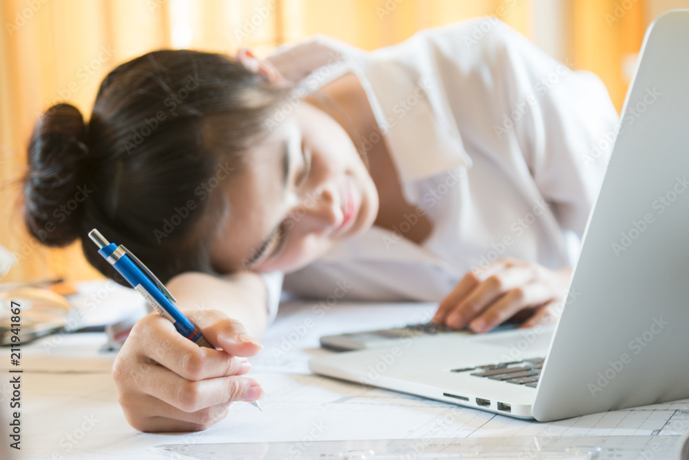 beautiful lady feeling bored and sleepy with her work beautiful lady feeling bored and sleepy with her work
