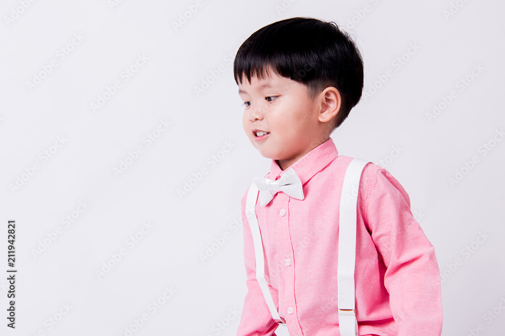 Smiling boy wears formal pink shirt and bow tie. Smiling boy wears formal pink shirt and bow tie.