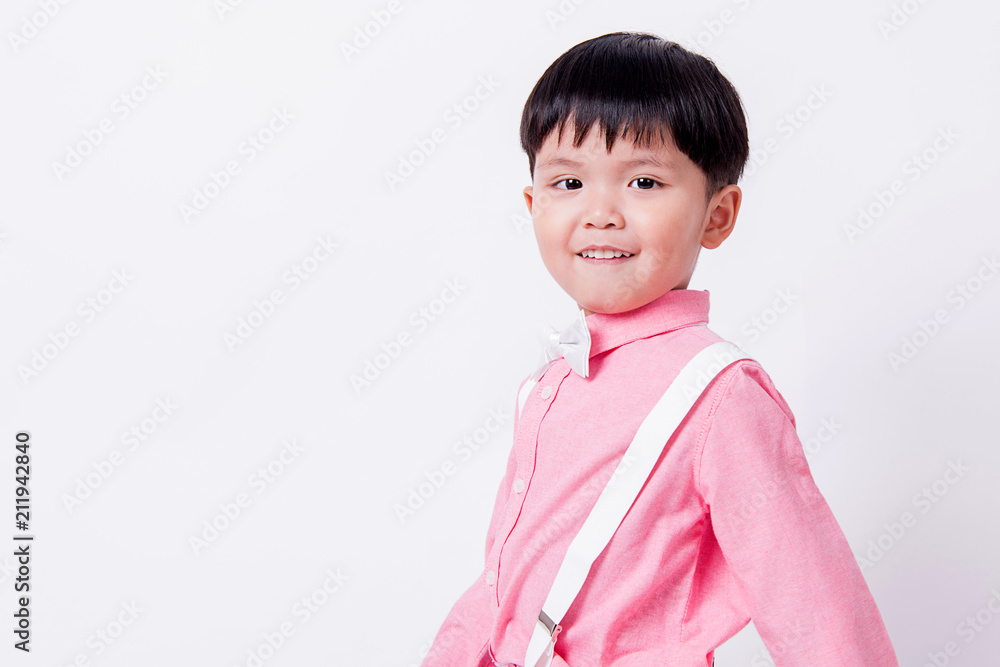 Smiling boy wears formal pink shirt and bow tie. Smiling boy wears formal pink shirt and bow tie.