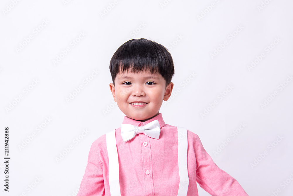 Smiling boy wears formal pink shirt and bow tie. Smiling boy wears formal pink shirt and bow tie.
