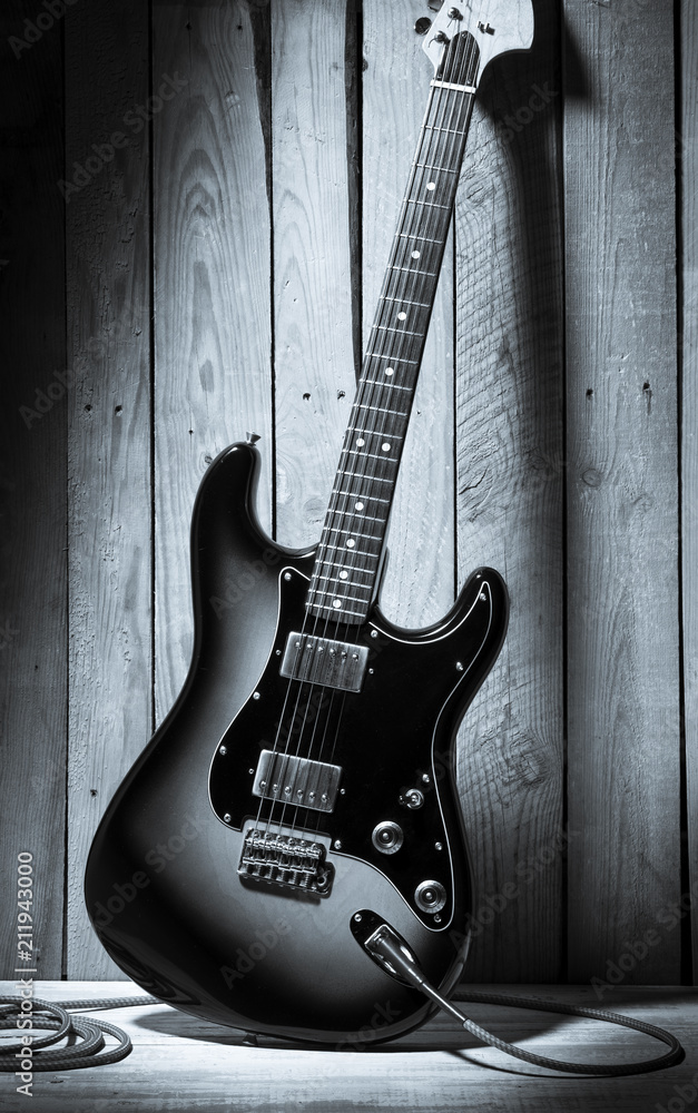 vintage electric guitar on wooden stage
