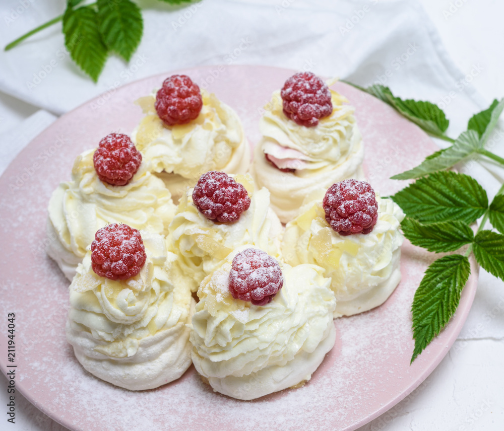 cakes made of egg white and whipped white cream with raspberries cakes made of egg white and whipped white cream with raspberries