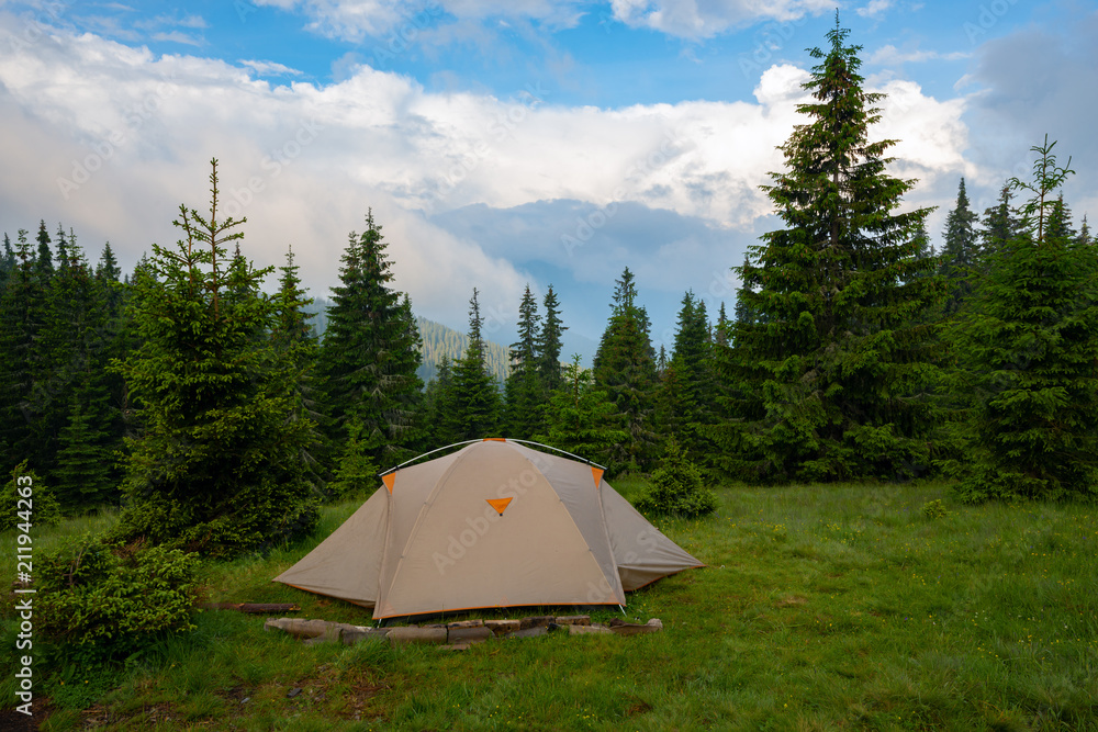 Tent on the green mountain meadow Tent on the green mountain meadow