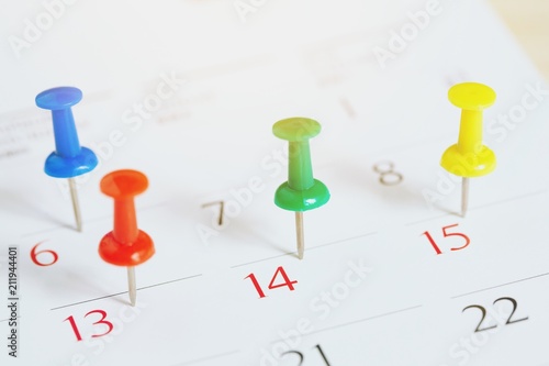 mark the event day with a pin. Thumbtack in calendar concept for busy timeline organize schedule,appointment and meeting reminder. planning for business meeting or travel holiday planning concept.